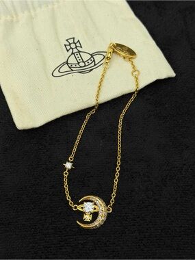 Vivienne Westwood Gold Crescent and Star Pendant bracelet